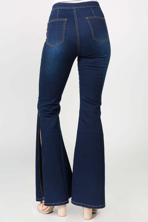 Dark blue side slit flare jeans with back pockets, showcasing stylish modern denim for a trendy fashion-forward look.