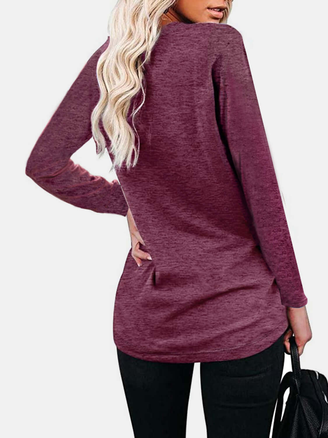 Woman wearing Bella Road round neck long sleeve maroon t-shirt with a pocket, slightly stretchy fabric, and comfortable fit.