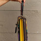 Nicole Lee USA small crossbody wallet showing side view with compartments and a removable strap.