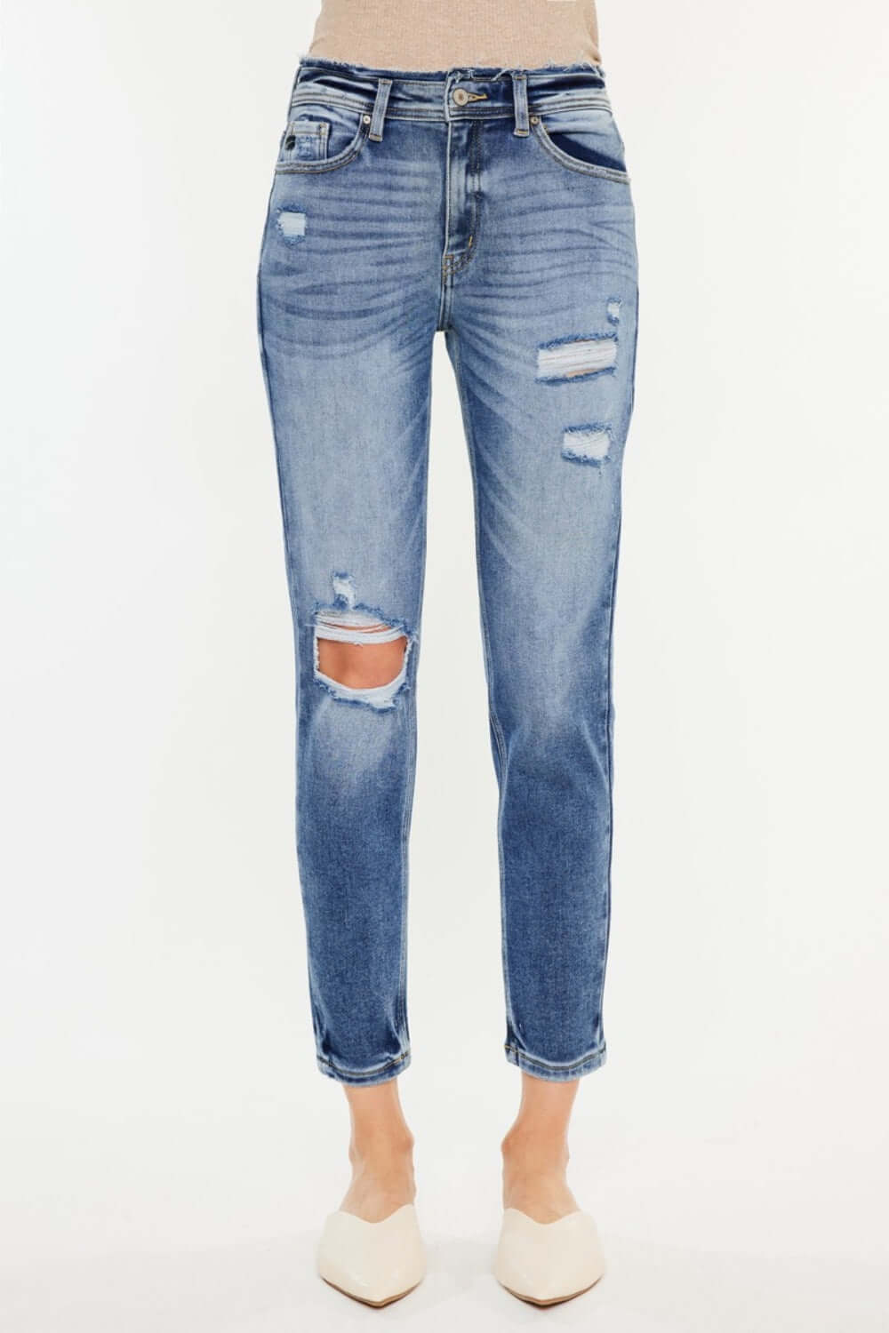 High Rise Distressed Mom Jeans with flattering high-rise waist and edgy tear details for a chic and stylish look. Perfect addition to your denim collection.