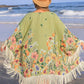 Plus size floral fringe cover-up in green, perfect beach outfit, featuring vibrant flowers and flowy sleeves.