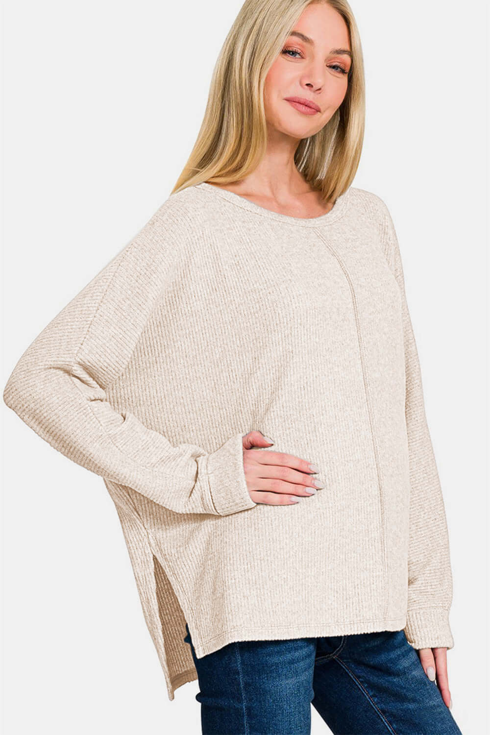 Woman wearing Zenana High-Low Side Slit Round Neck T-Shirt in beige with a relaxed fit, perfect for a casual yet polished look.