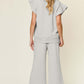 Back view of a grey Texture Ruffle Short Sleeve Top and Drawstring Wide Leg Pants Set worn by a woman.