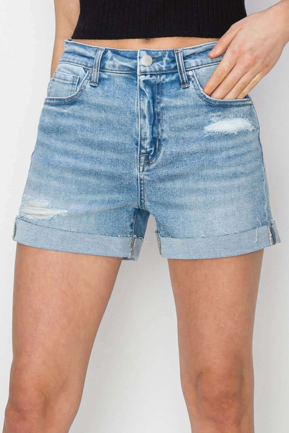 Distressed Mid-Rise Waist Denim Shorts by Risen Jeans, perfect for a chic and relaxed summer look with edgy distressed detailing.