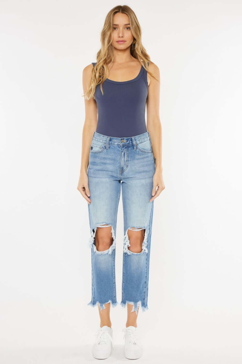 High Waist Chewed Up Straight Mom Jeans with distressed holes and frayed edges on woman, trendy vintage-inspired style for a flattering fit