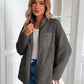 Woman wearing Ivy Lane Zip Up Long Sleeve Fuzzy Jacket in gray, paired with jeans and a white top in elegant indoor setting.