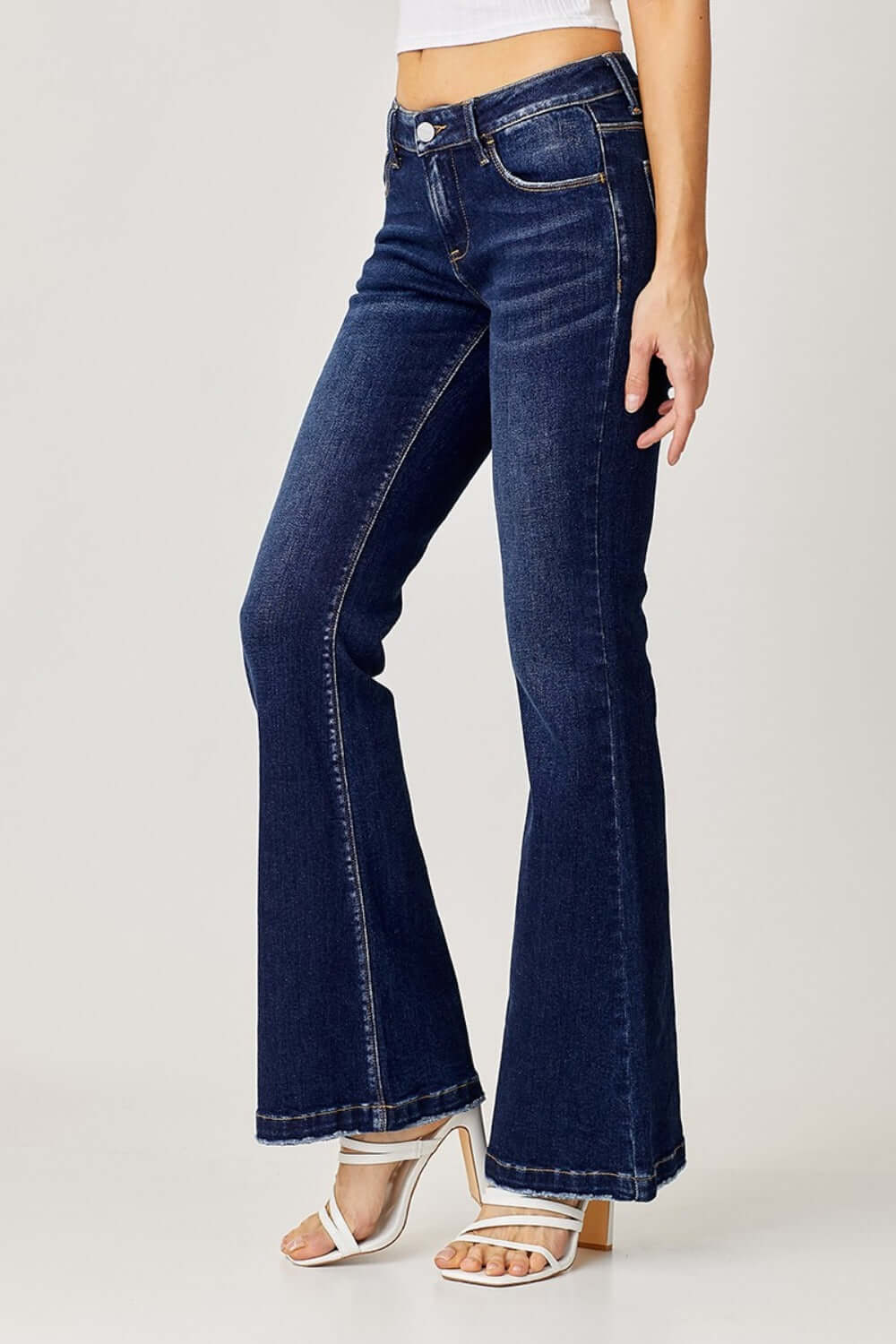 RISEN full size low rise flare jeans with retro styling and flattering silhouette in dark wash, perfect for any casual or dressy look.