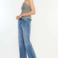 Ultra High Rise Cat's Whiskers Jeans modeled with a grey tank top, showcasing the flattering high-waisted silhouette and vintage detailing