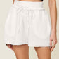 DOUBLE TAKE Full Size Texture Raw Trim Drawstring Shorts at Bella Road