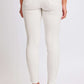 Woman wearing YMI Jeans Hyperstretch Mid-Rise Skinny Jeans in white, showcasing back view and stylish fit.