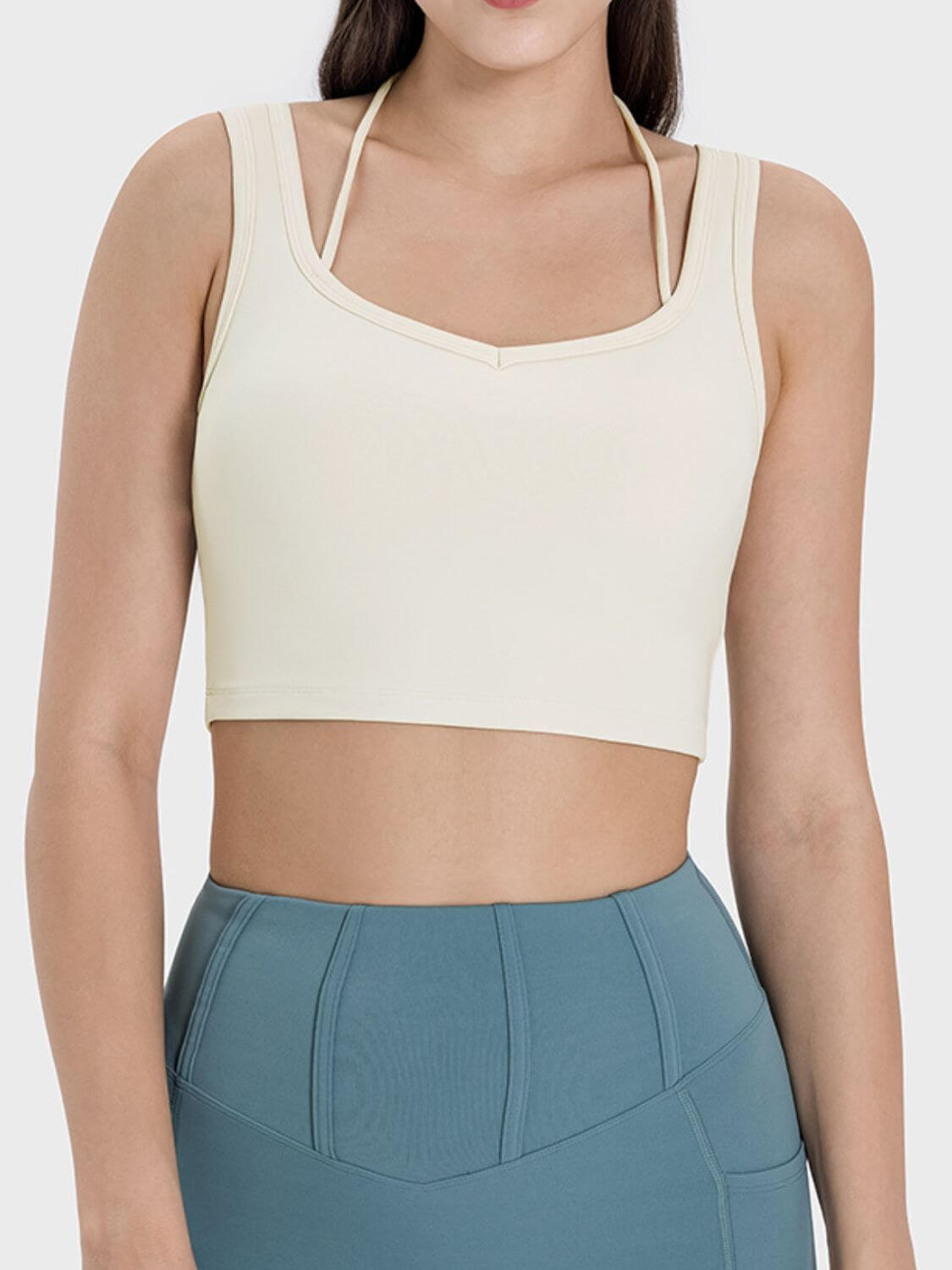 Stylish Millennia Crisscross Square Neck Active Tank in light beige, perfect for workouts and casual wear.