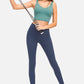 Model showcasing Millennia Deep V-Neck Crop Sports Bra in teal, paired with navy leggings and fitness resistance band.