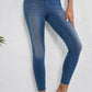 High waist skinny jeans with moderate stretch, showcasing a flattering fit. Perfect for any occasion, made of 47% polyester, 42% cotton, 11% elastane.