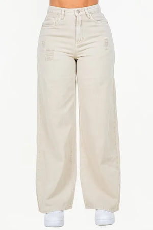 High waist distressed wide leg jeans in light color, offering a trendy and comfortable fit.