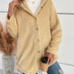 Cozy pastel yellow fuzzy button-up hooded jacket styled with ripped jeans and coffee, perfect for chilly days.