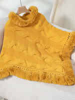 Cozy Bella Road fuzzy hem cable-knit poncho in vibrant gold, perfect for chilly days and stylish layering.