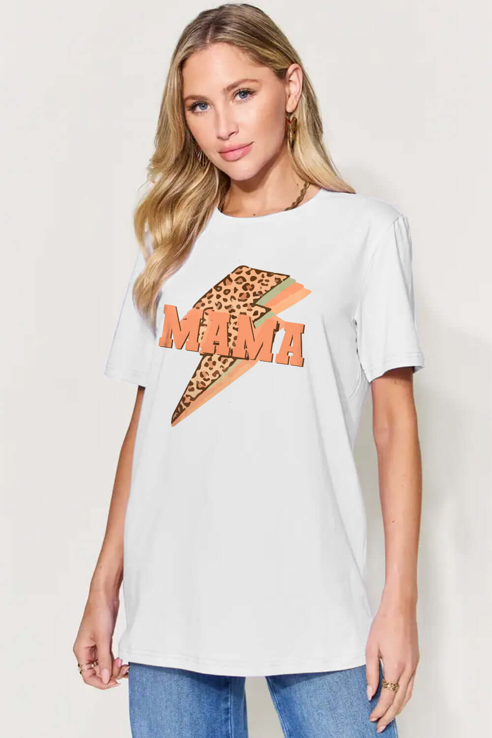 Woman wearing MAMA round-neck short sleeve T-shirt with leopard print lightning bolt design, casual style, full size.