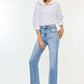 Model wearing high waist raw hem straight jeans paired with a white shirt and sandals for a chic casual look.