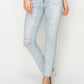 High rise distressed skinny jeans featuring a ripped knee, perfect for casual outfits - Risen Jeans.