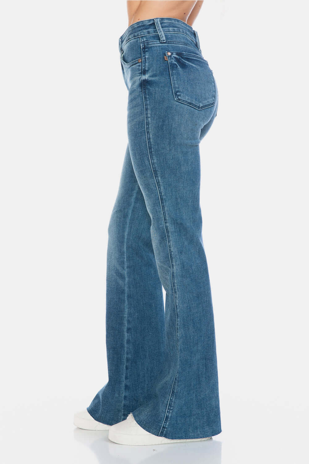 Stylish Judy Blue full size tummy control cut hem flare jeans side view, featuring a vintage wash for a timeless and flattering silhouette.