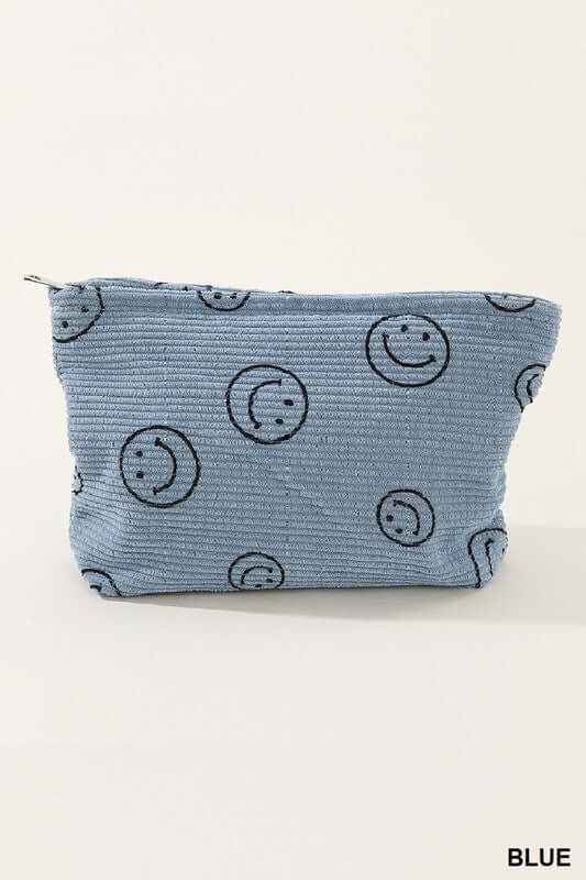 Cute blue corduroy clutch bag featuring a playful smiley face print, perfect for casual outings and adding style.