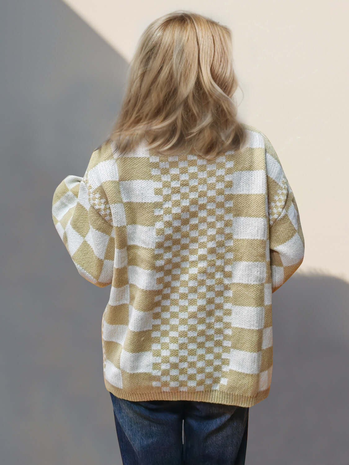 Cozy tan checkered open front cardigan with dropped shoulders viewed from the back, perfect for a playful style boost.