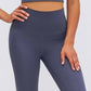 Ultra soft high waist leggings in solid navy blue, paired with a cropped top for a chic athleisure look.