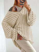 Woman wearing Bella Road V-Neck Long Sleeve Sweater in cream, showcasing trendy fall fashion with versatile, cozy design.