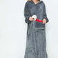 Cozy model in a gray hooded midi lounge dress with pockets, perfect for chilly fall days and stylish lounging.