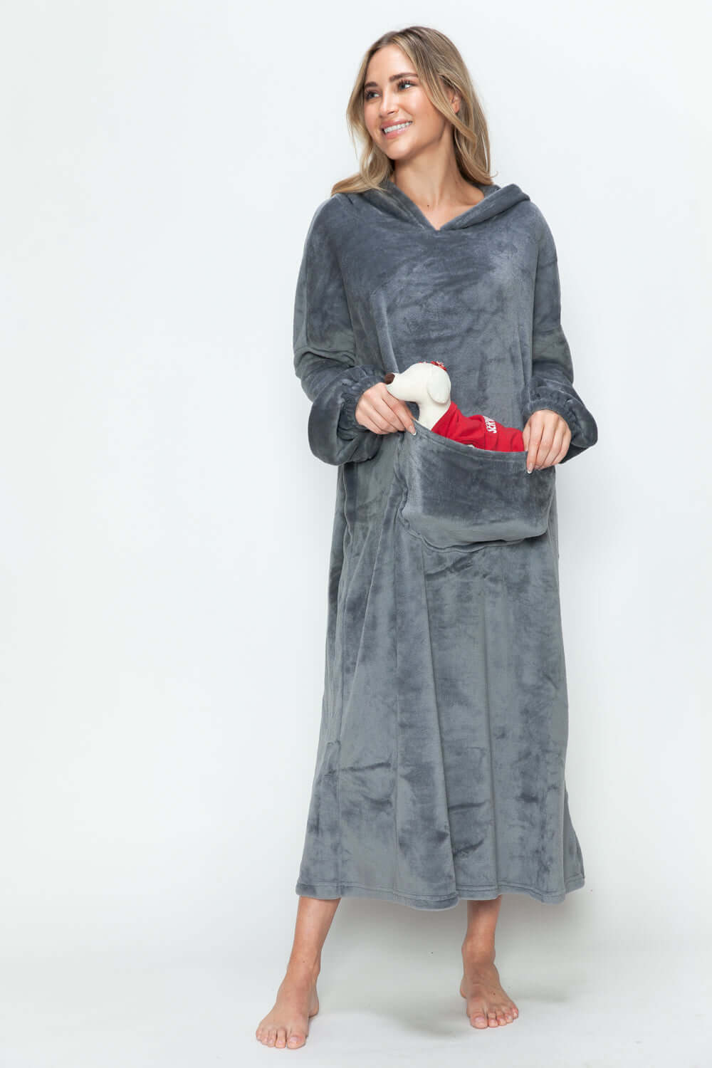 Cozy model in a gray hooded midi lounge dress with pockets, perfect for chilly fall days and stylish lounging.