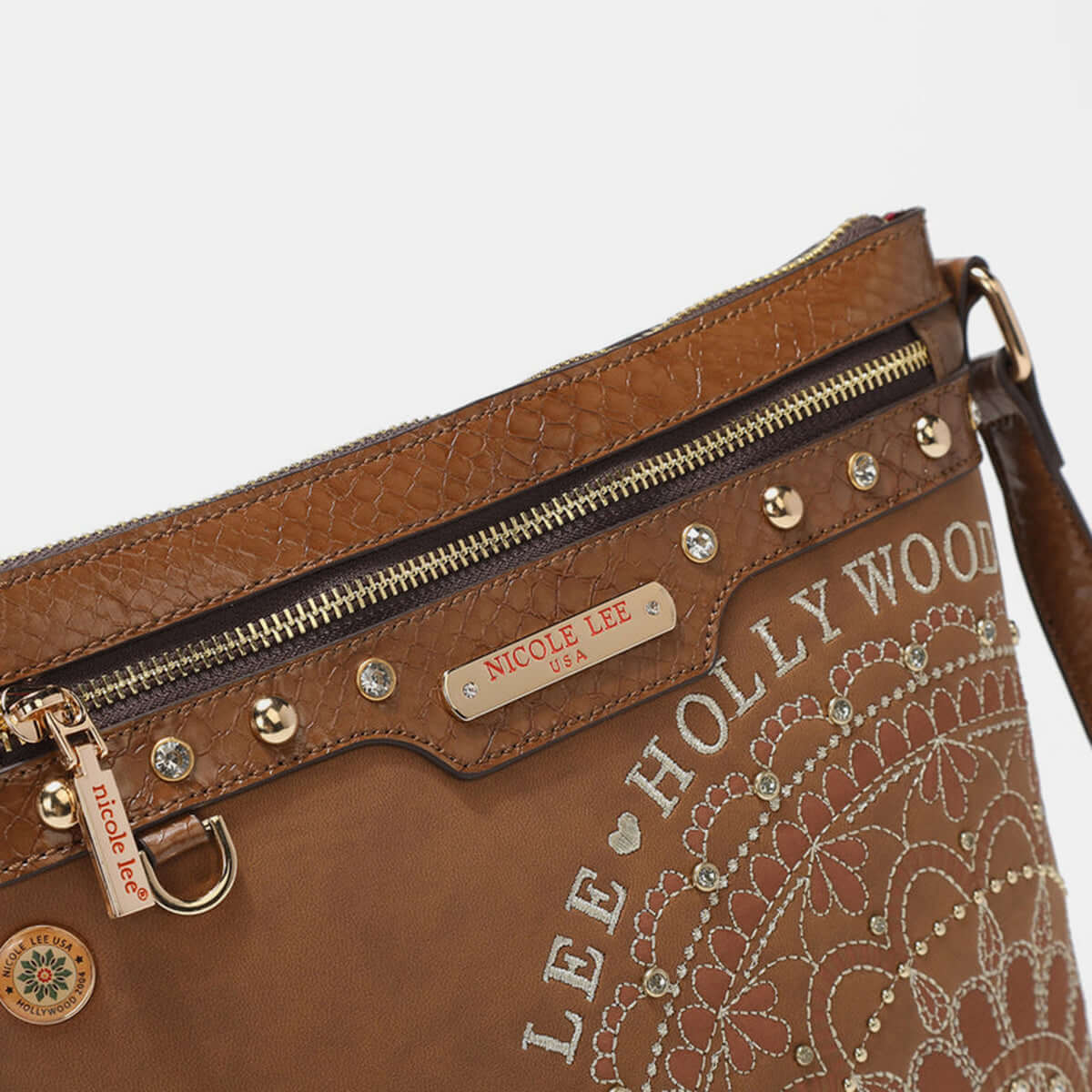 Nicole Lee USA crossbody bag with metallic stitching, embroidery, and inlaid rhinestones, featuring front zipper and stylish design.