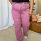 Woman wearing RFM Full Size High Rise Garment Dye Wide Leg Jeans in rich pink color, stylish high-waist fit, soft and comfortable fabric.