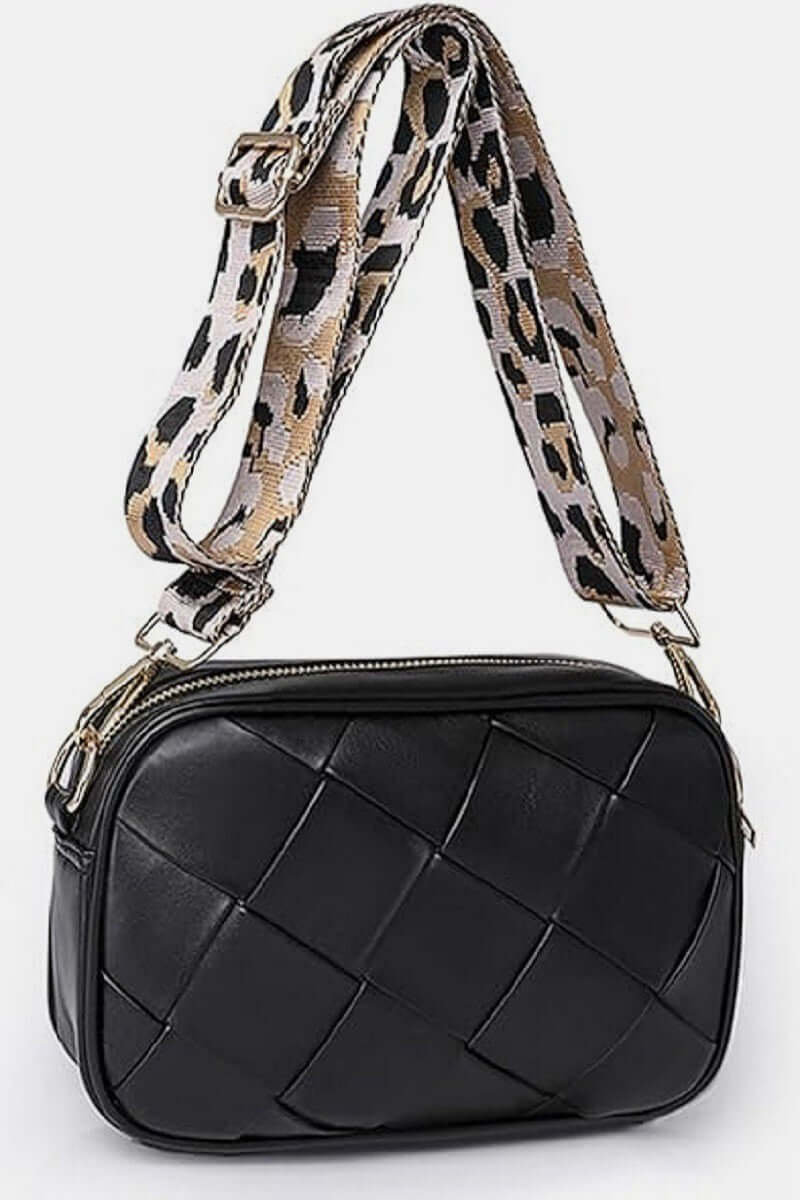 Stylish black Cassette Woven Crossbody Bag with a leopard print adjustable strap for hands-free convenience.