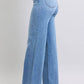 Judy Blue women's wide leg jeans with pockets in light wash, showcasing a relaxed vintage silhouette and stylish design.