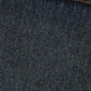 Close-up of textured dark denim fabric with orange stitching accents, perfect for stylish apparel creation.