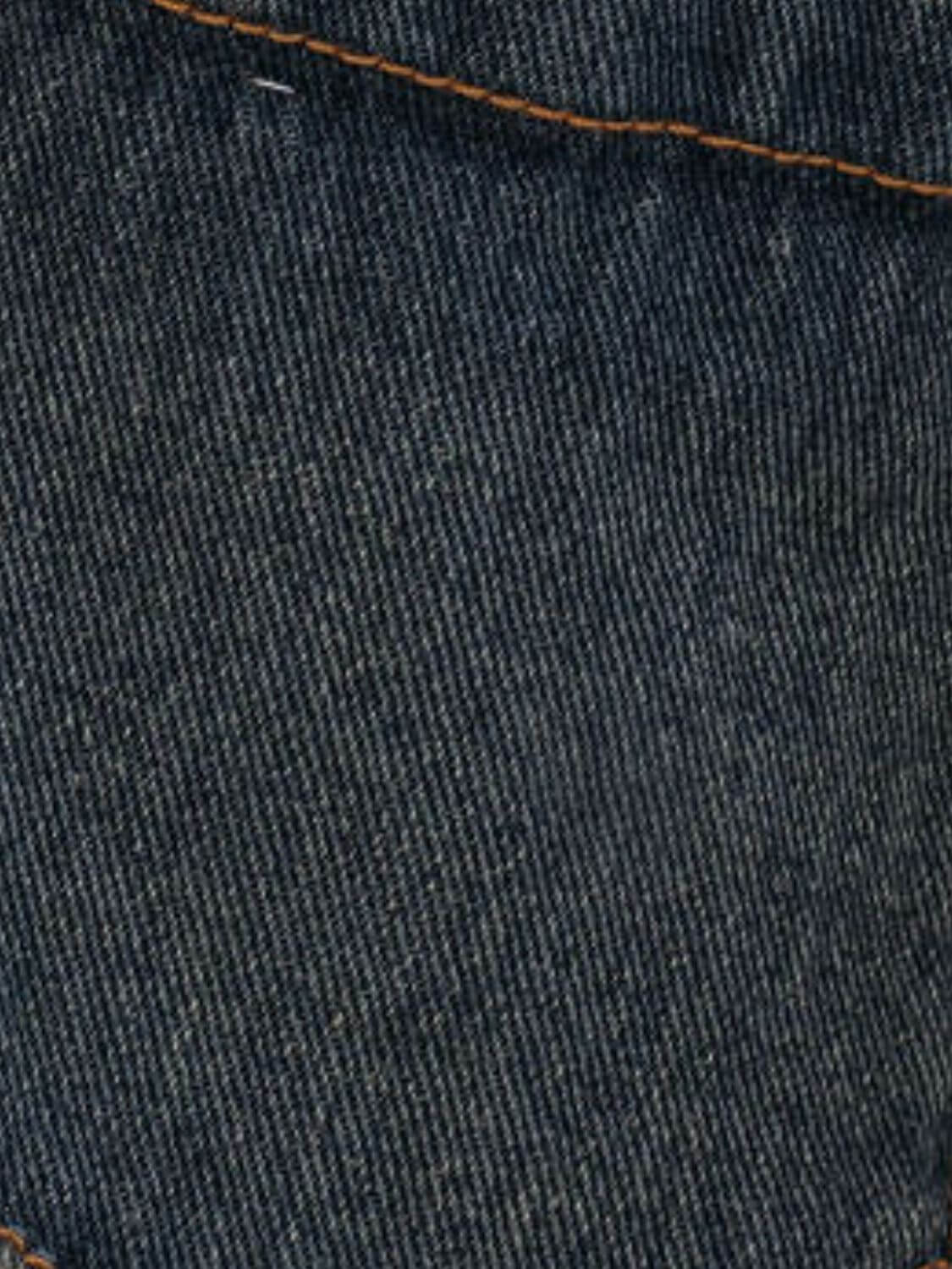 Close-up of textured dark denim fabric with orange stitching accents, perfect for stylish apparel creation.