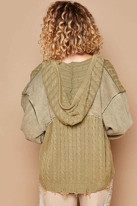 Back view of a stylish olive green distressed hem hooded cardigan with curly hair model. Perfect for casual layering.