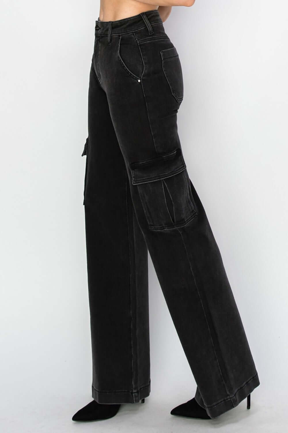 Side view of Risen Jeans - High Rise Wide Leg Cargo Jeans showcasing cargo pockets and wide-leg silhouette in a sleek black color.