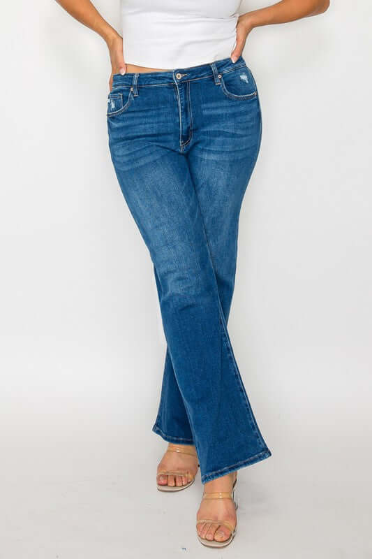 Stylish model showcasing bytos Cat's Whiskers High Rise Straight Jeans in a flattering blue wash with a relaxed fit.