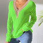 Bright green openwork V-neck sweater with long sleeves and stylish knit pattern, perfect for a trendy and cozy look.