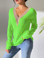 Bright green openwork V-neck sweater with long sleeves and stylish knit pattern, perfect for a trendy and cozy look.