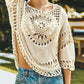 Bella Road Swim Cutout Round Neck Half Sleeve Cover Up in cream with intricate crochet detailing, perfect for beach days.