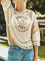 Bella Road Swim Cutout Round Neck Half Sleeve Cover Up in cream with intricate crochet detailing, perfect for beach days.