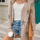 Woman wearing Angel Wings Star Open Front Long Sleeve Cardigan, holding coffee, embracing cozy-chic vibes with a playful star design.