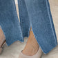 Close-up of Bella Road Slit Bootcut Jeans with Pockets and two-tone shoes