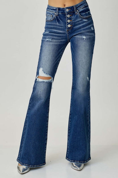 Distressed button-fly flare jeans with pockets and slightly stretchy fabric, perfect for a casual chic look. Risen Jeans.