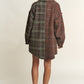 Woman wearing J.NNA tweed plaid longline shacket with contrasting details, perfect for fall layering and stylish comfort.