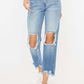 Vintage-inspired high waist chewed up straight mom jeans with distressed holes and frayed edges for an edgy and flattering look