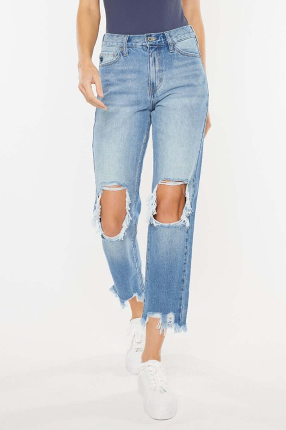 Vintage-inspired high waist chewed up straight mom jeans with distressed holes and frayed edges for an edgy and flattering look