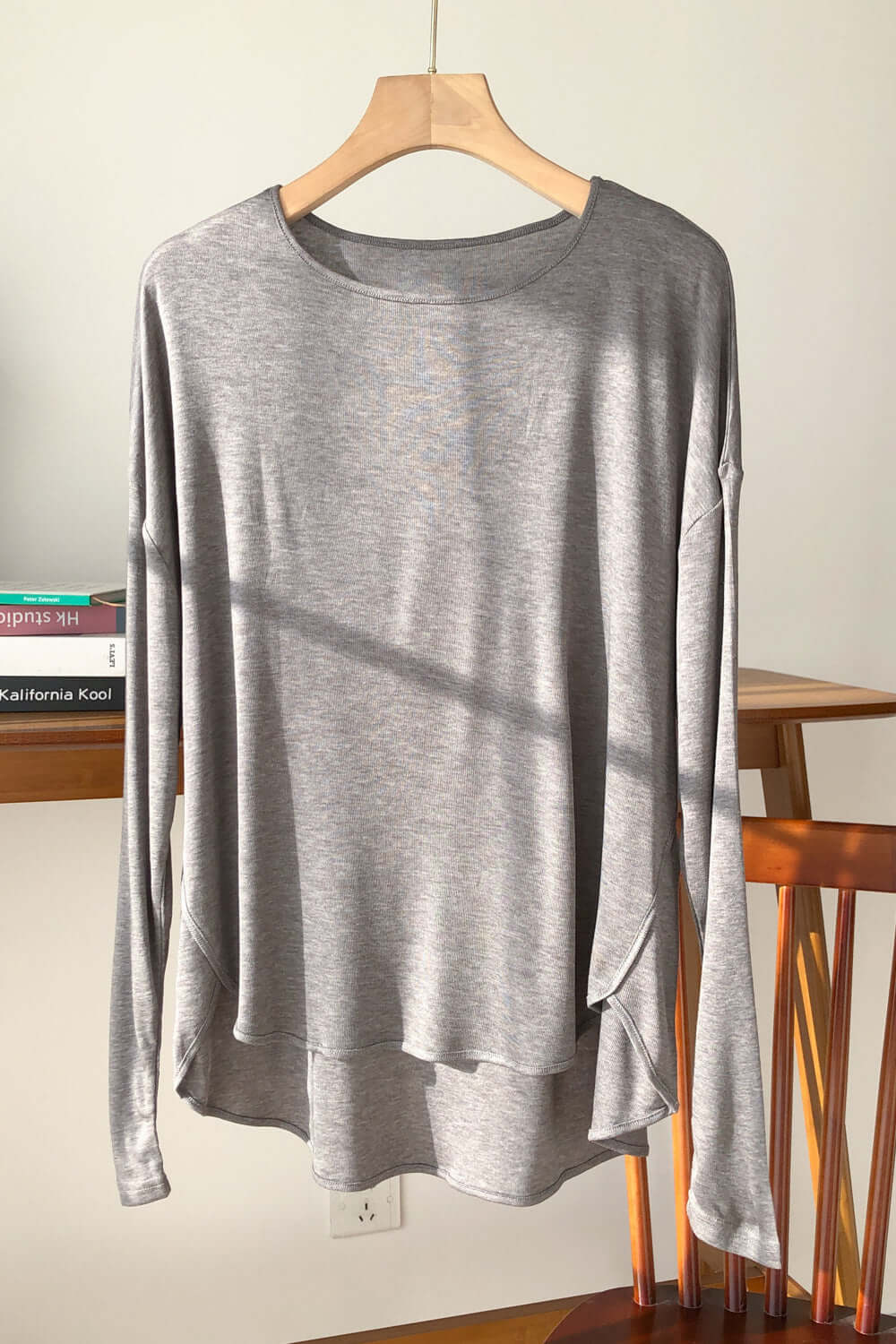 Gray Basic Bae High-Low Long Sleeve T-Shirt in natural light, showcasing sheer design and soft stretchy material.